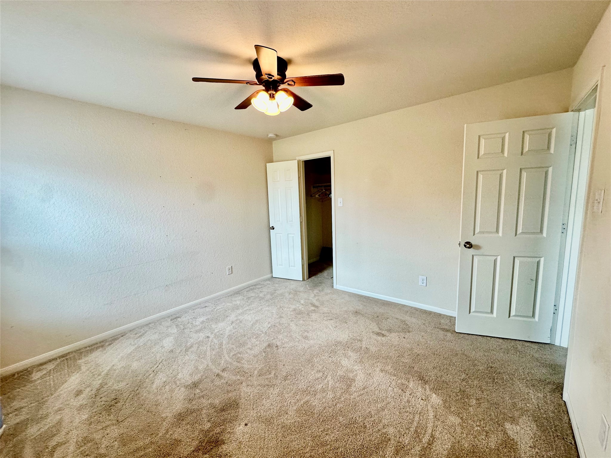 18622 Each Elm Way Houston, TX 77084 - Photo 33 of 35 a view of empty room with ceiling fan