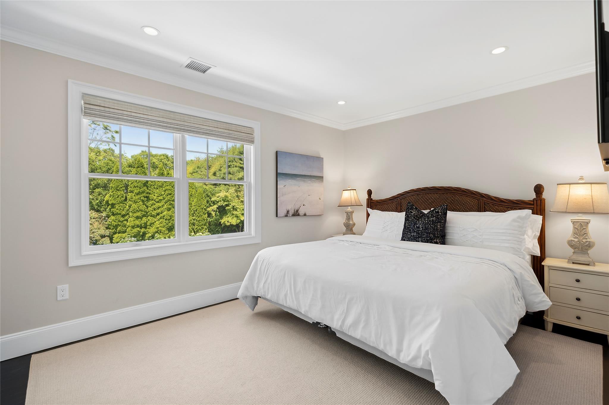 146 Coopers Farm Road Southampton, NY 11968 - Photo 13 of 25 a bedroom with a bed and window