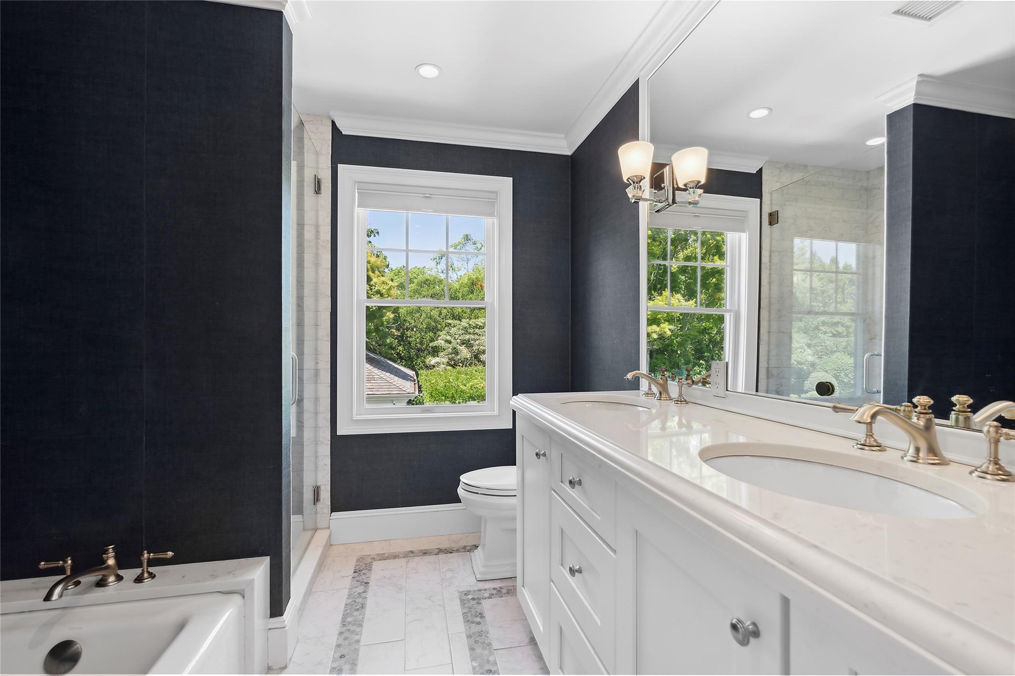 146 Coopers Farm Road Southampton, NY 11968 - Photo 18 of 25 a bathroom with a tub sink and mirror