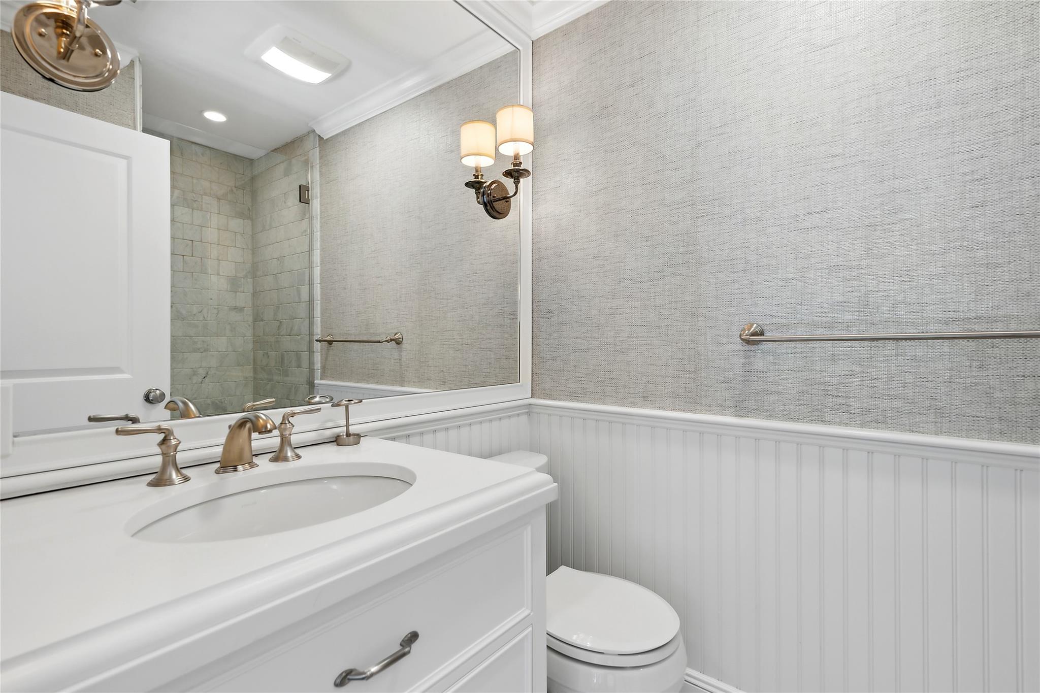 146 Coopers Farm Road Southampton, NY 11968 - Photo 19 of 25 a bathroom with a sink a toilet and shower