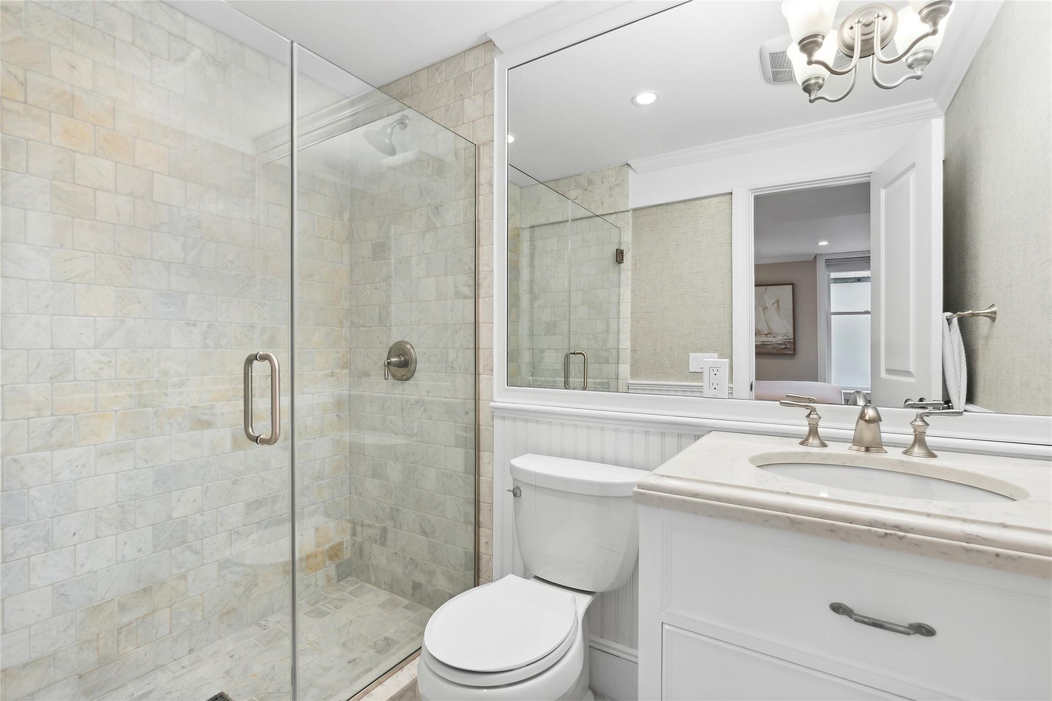 146 Coopers Farm Road Southampton, NY 11968 - Photo 23 of 25 a bathroom with a sink a toilet and shower