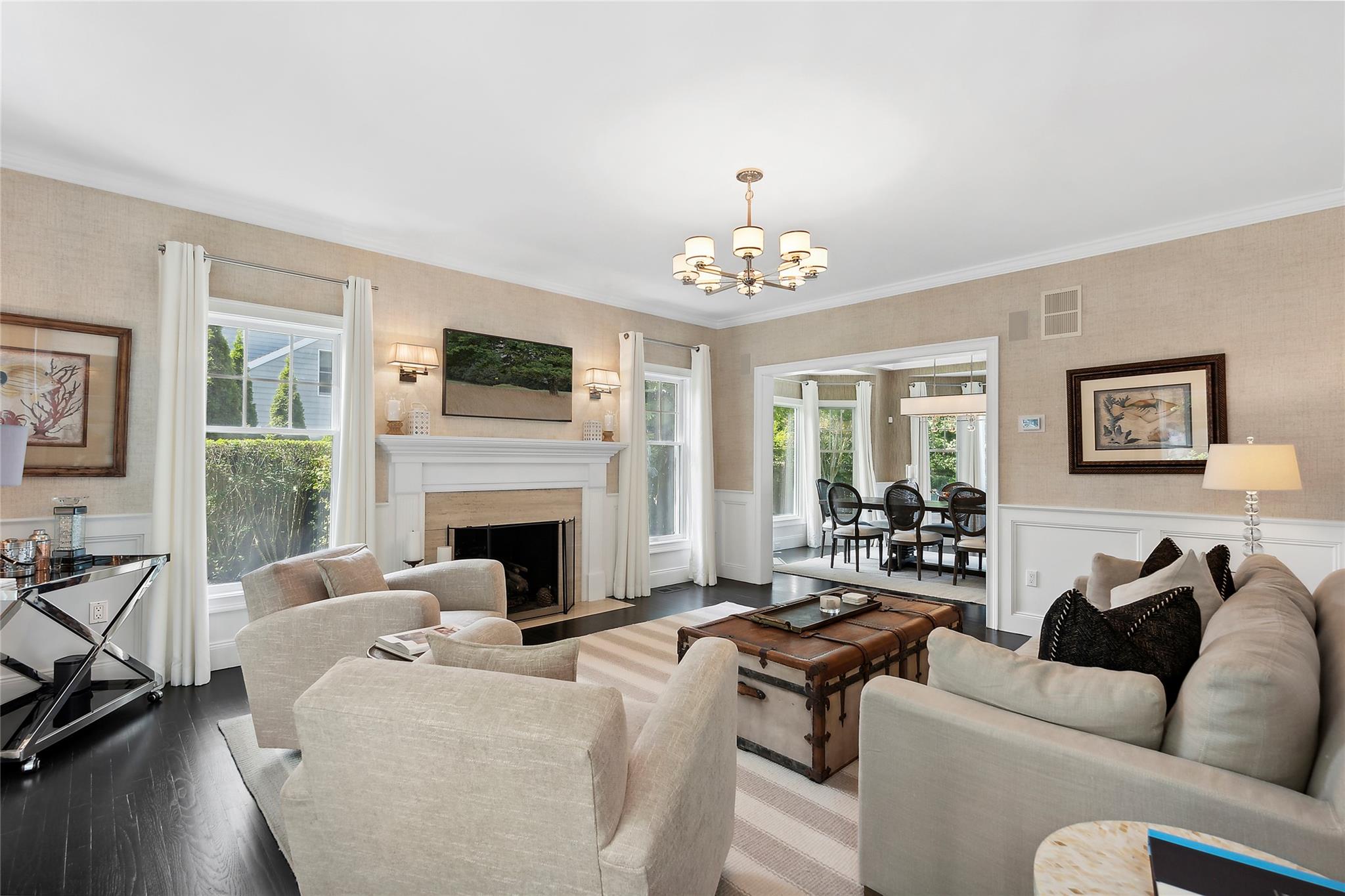 146 Coopers Farm Road Southampton, NY 11968 - Photo 8 of 25 a living room with furniture a fireplace and a flat screen tv