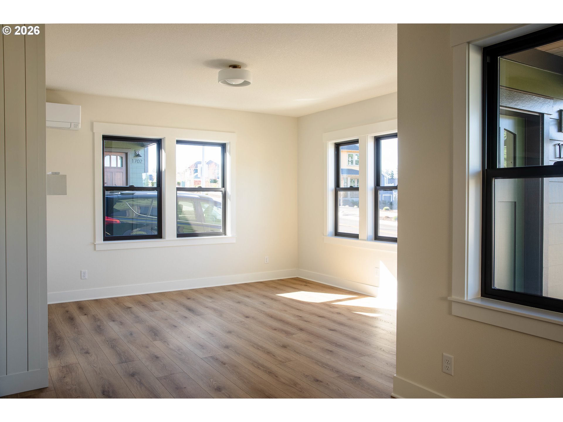 1710 Strong Road Southeast Salem, OR 97302 - Photo 15 of 18 a view of an empty room with wooden floor and a window