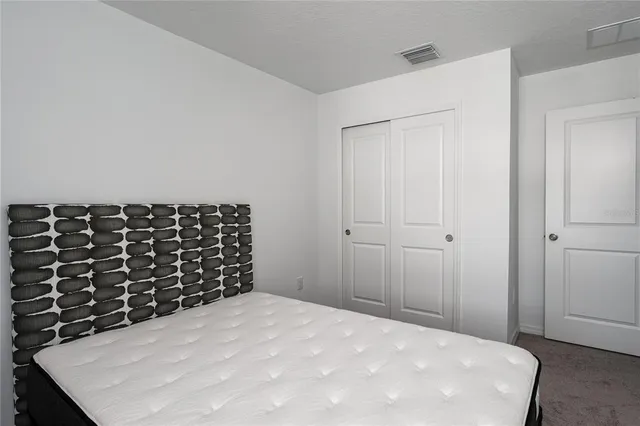 an aerial view of multiple houses with a big yard