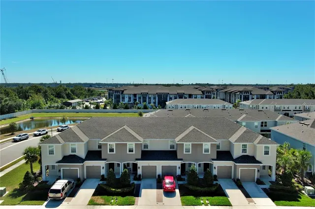 an aerial view of a house with a swimming pool
