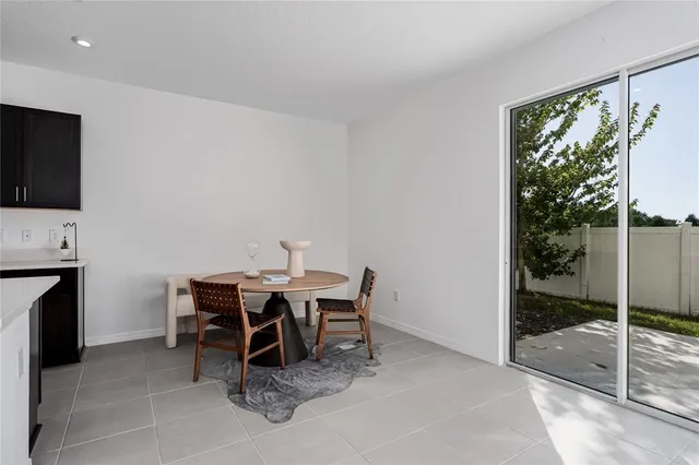 a kitchen with stainless steel appliances a stove top oven a sink a microwave a refrigerator and cabinets