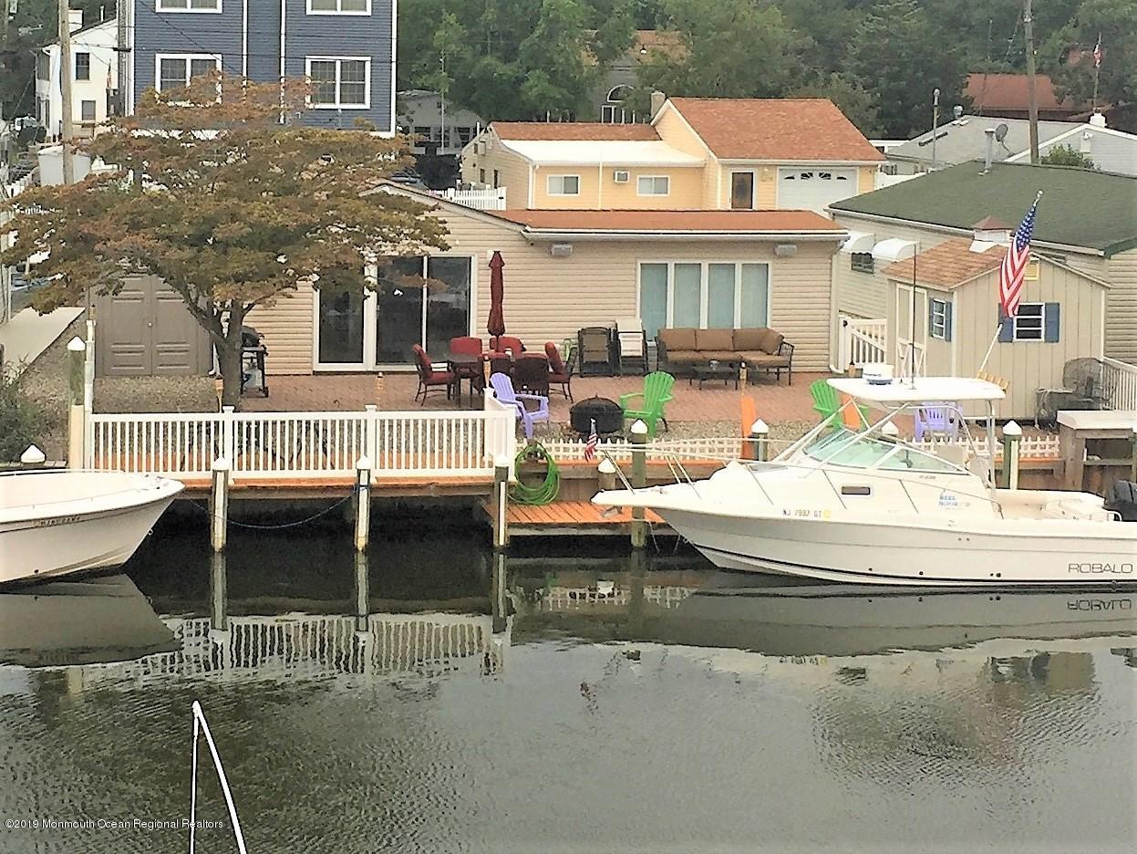 20 Capstan Road Waretown, NJ 08758 - Photo 1 of 25 a front view of building with outdoor seating