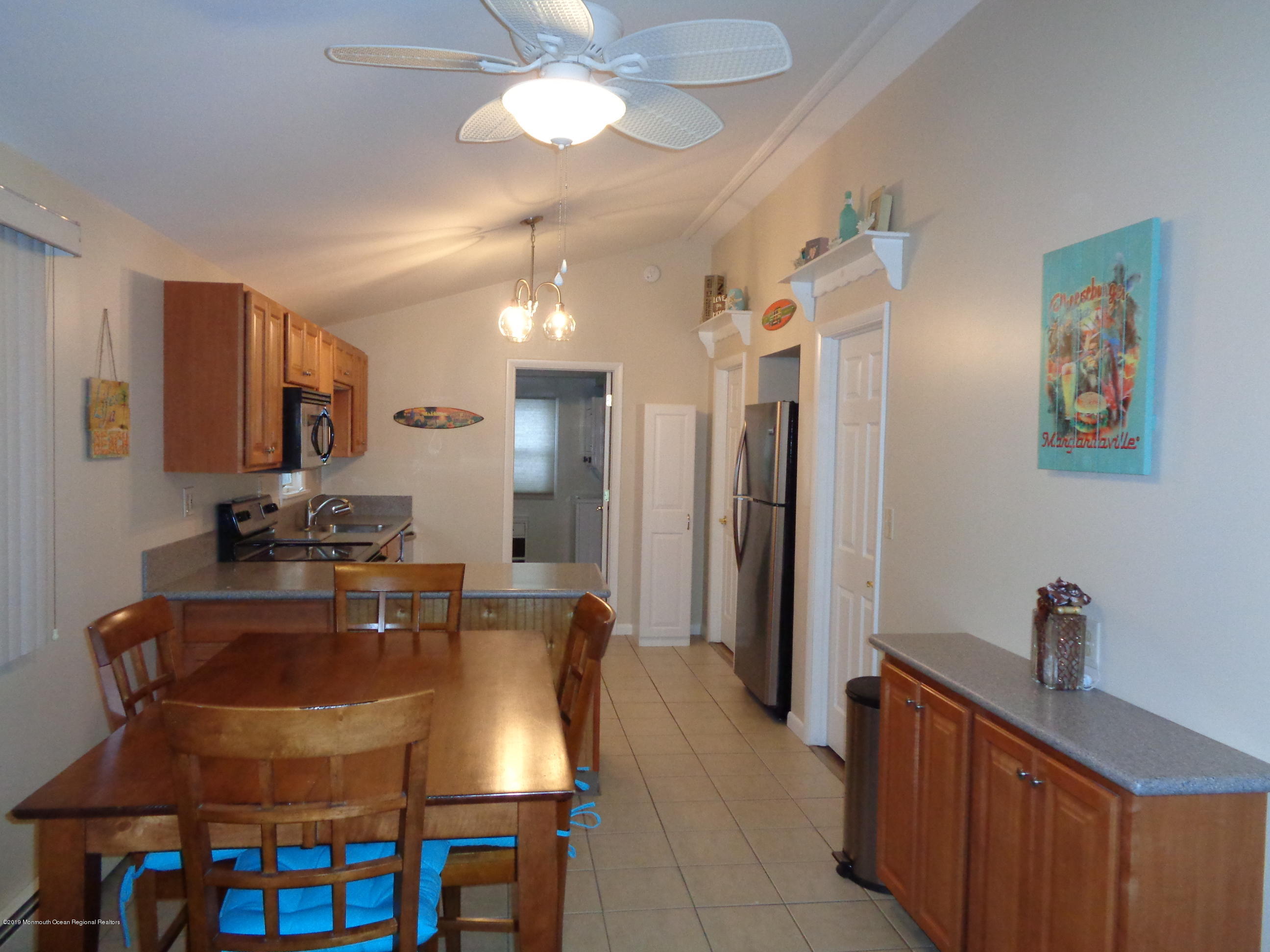 20 Capstan Road Waretown, NJ 08758 - Photo 12 of 25 a large kitchen with a table and chairs