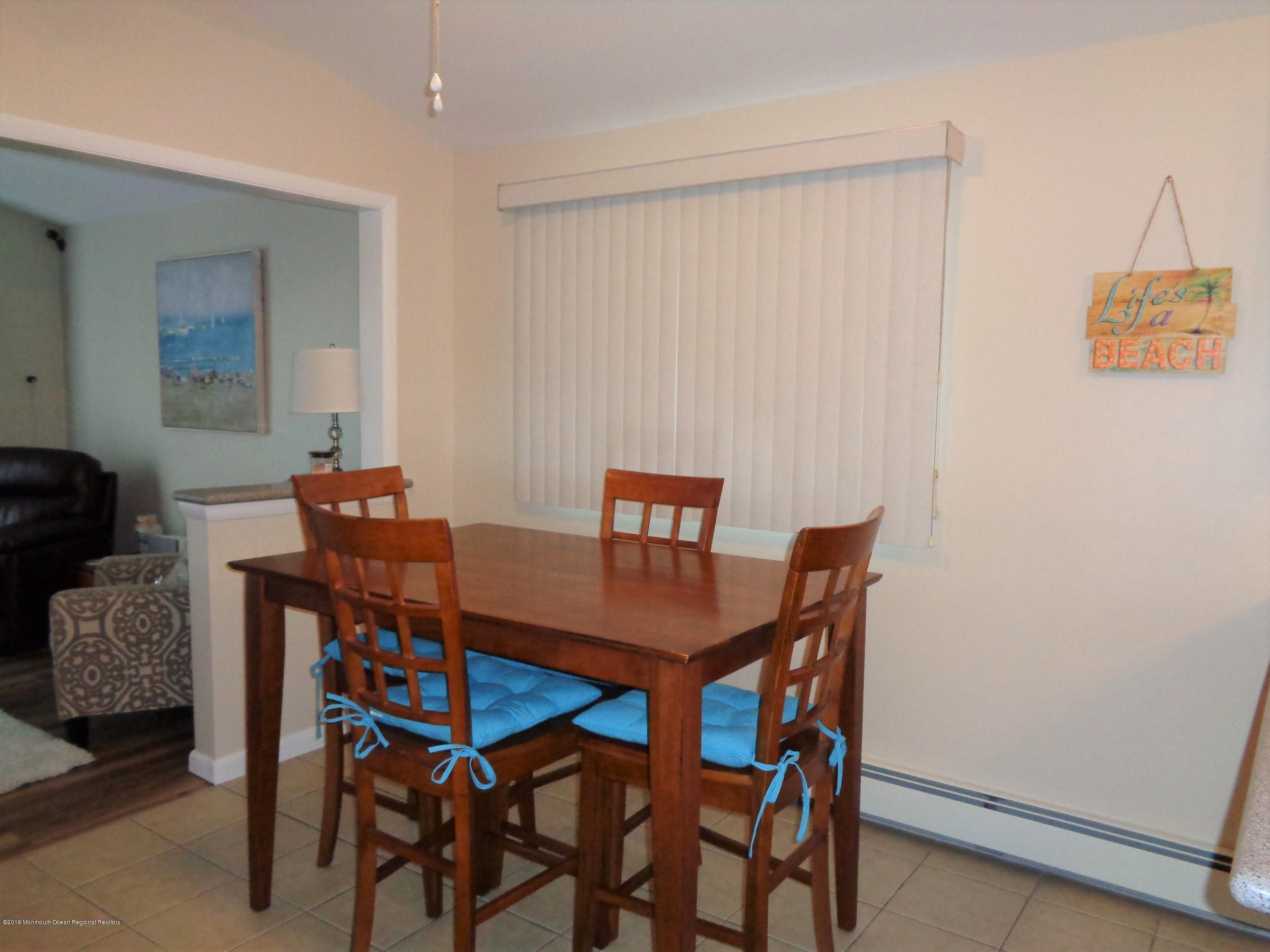 20 Capstan Road Waretown, NJ 08758 - Photo 13 of 25 a view of a dining room with furniture and a window