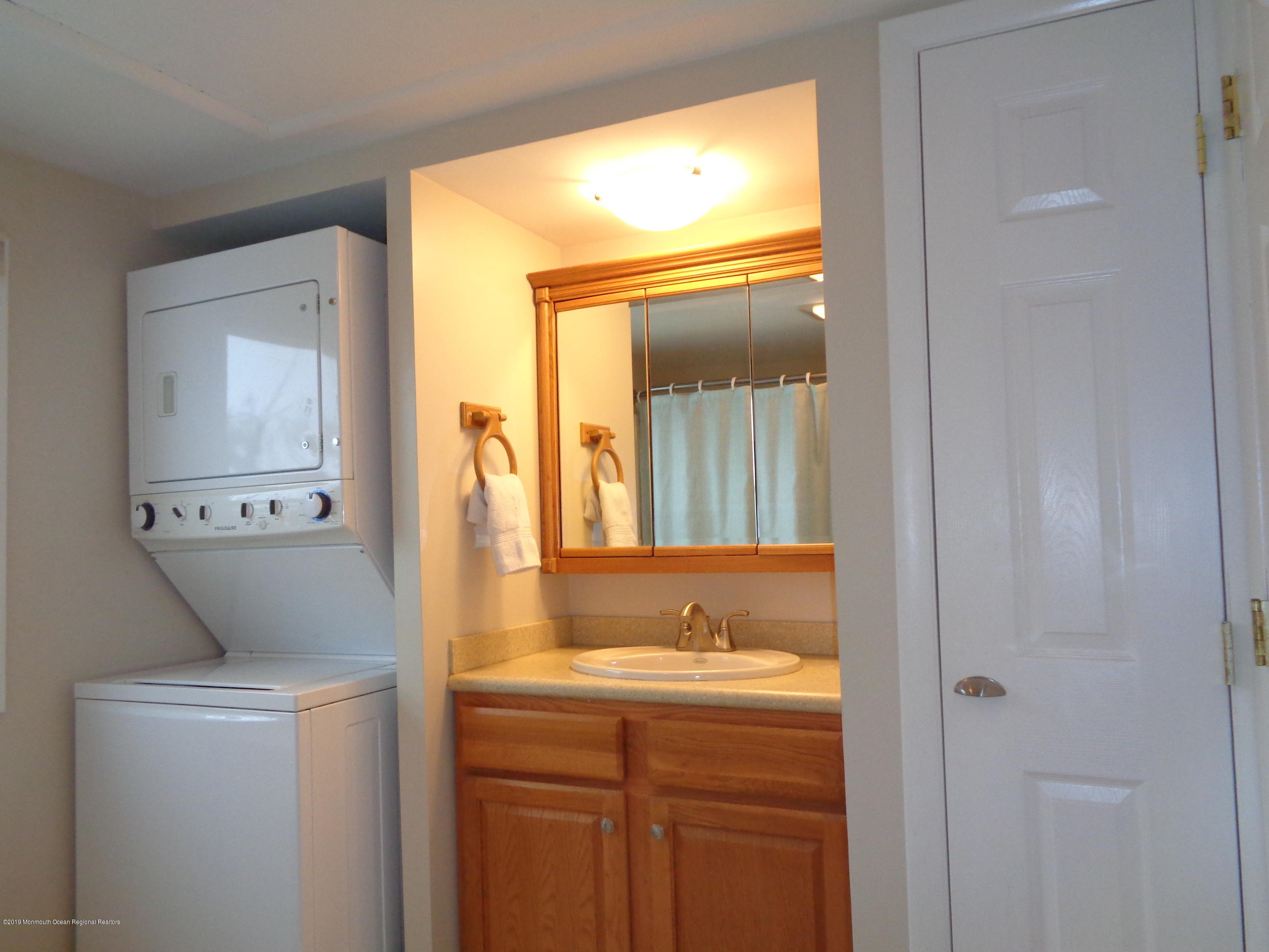 20 Capstan Road Waretown, NJ 08758 - Photo 16 of 25 a bathroom with a sink and a mirror