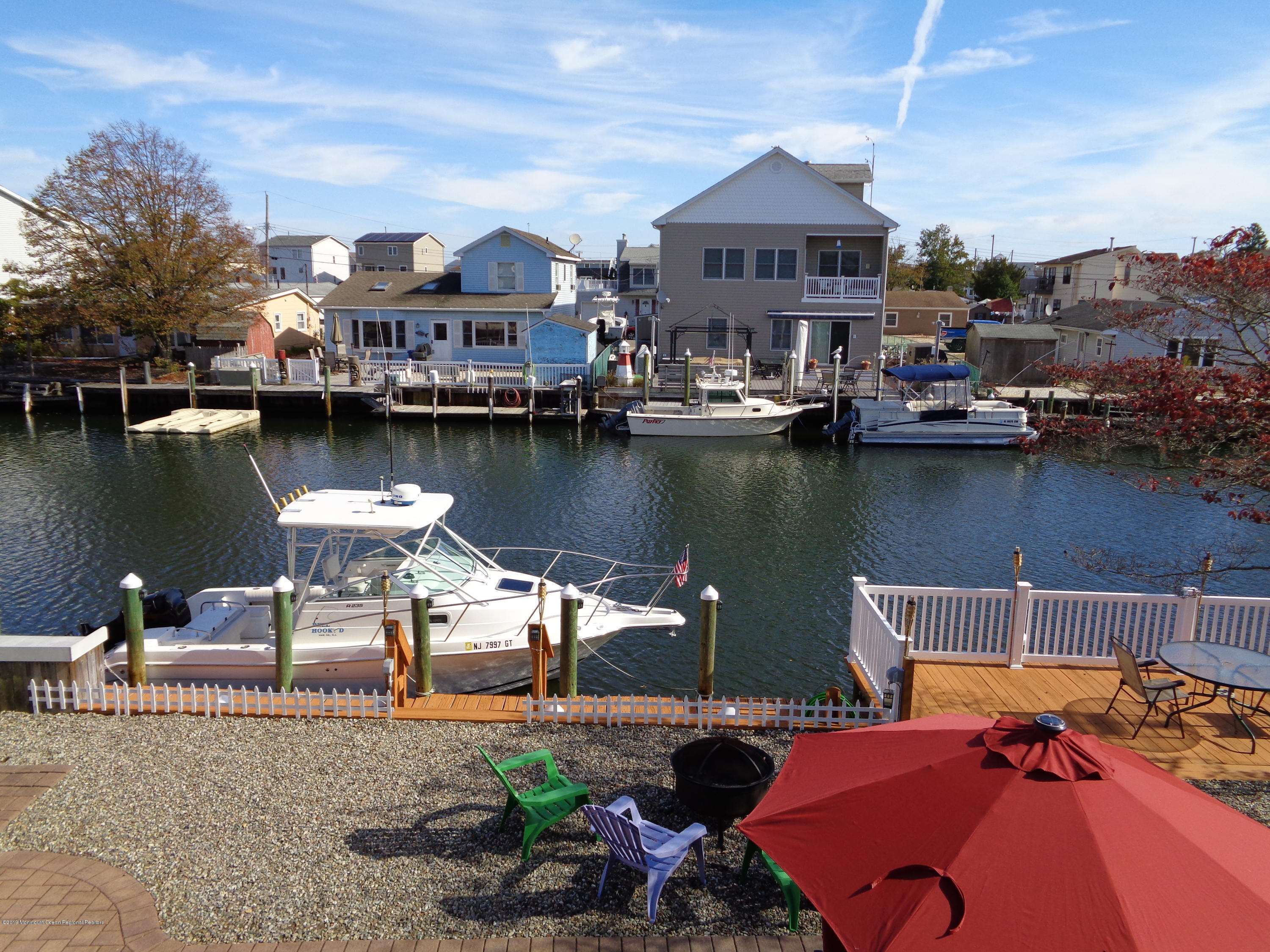 20 Capstan Road Waretown, NJ 08758 - Photo 18 of 25 an aerial view of a house with outdoor space and a lake view