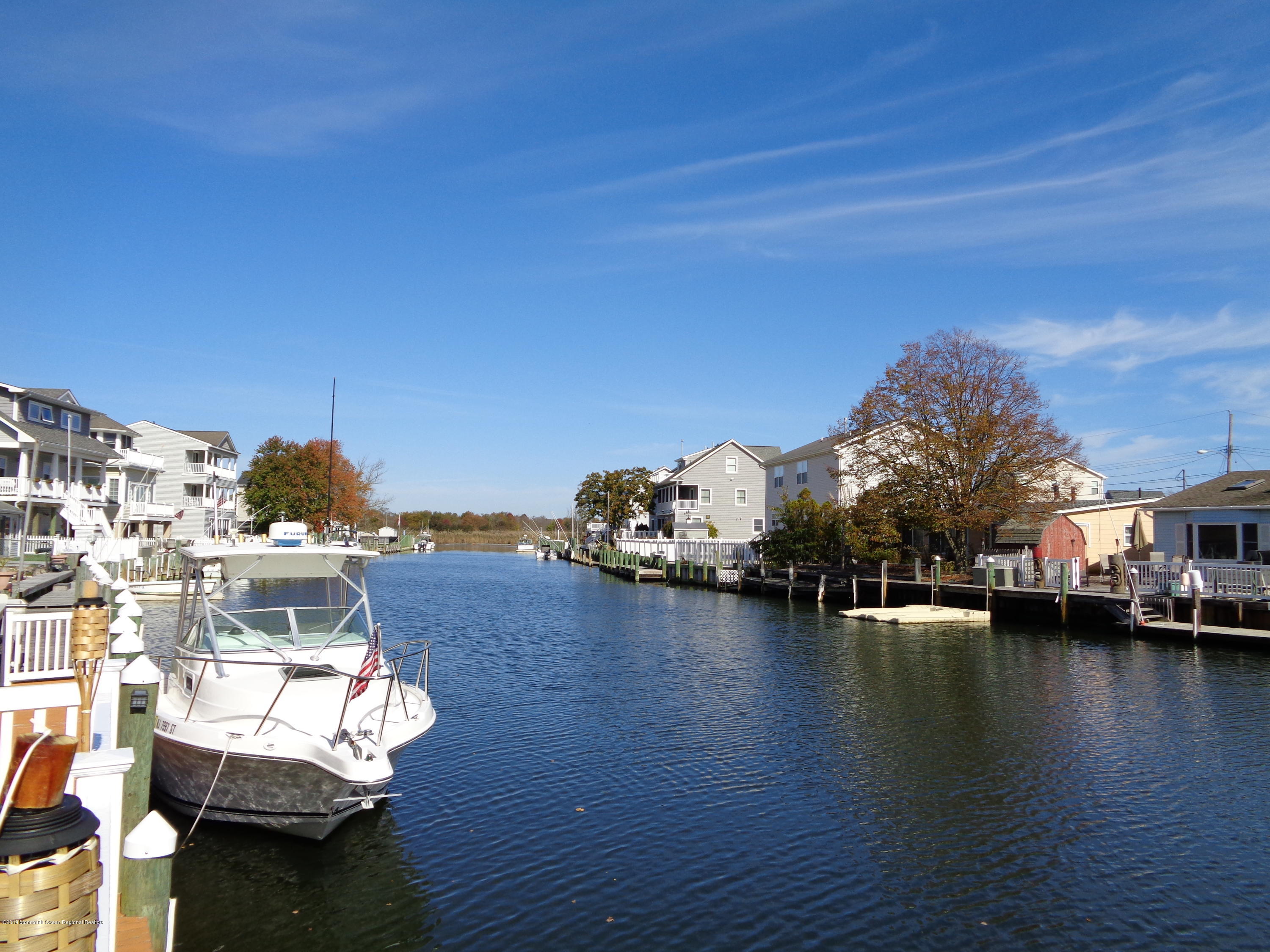 20 Capstan Road Waretown, NJ 08758 - Photo 20 of 25 a view of a lake with couches chairs
