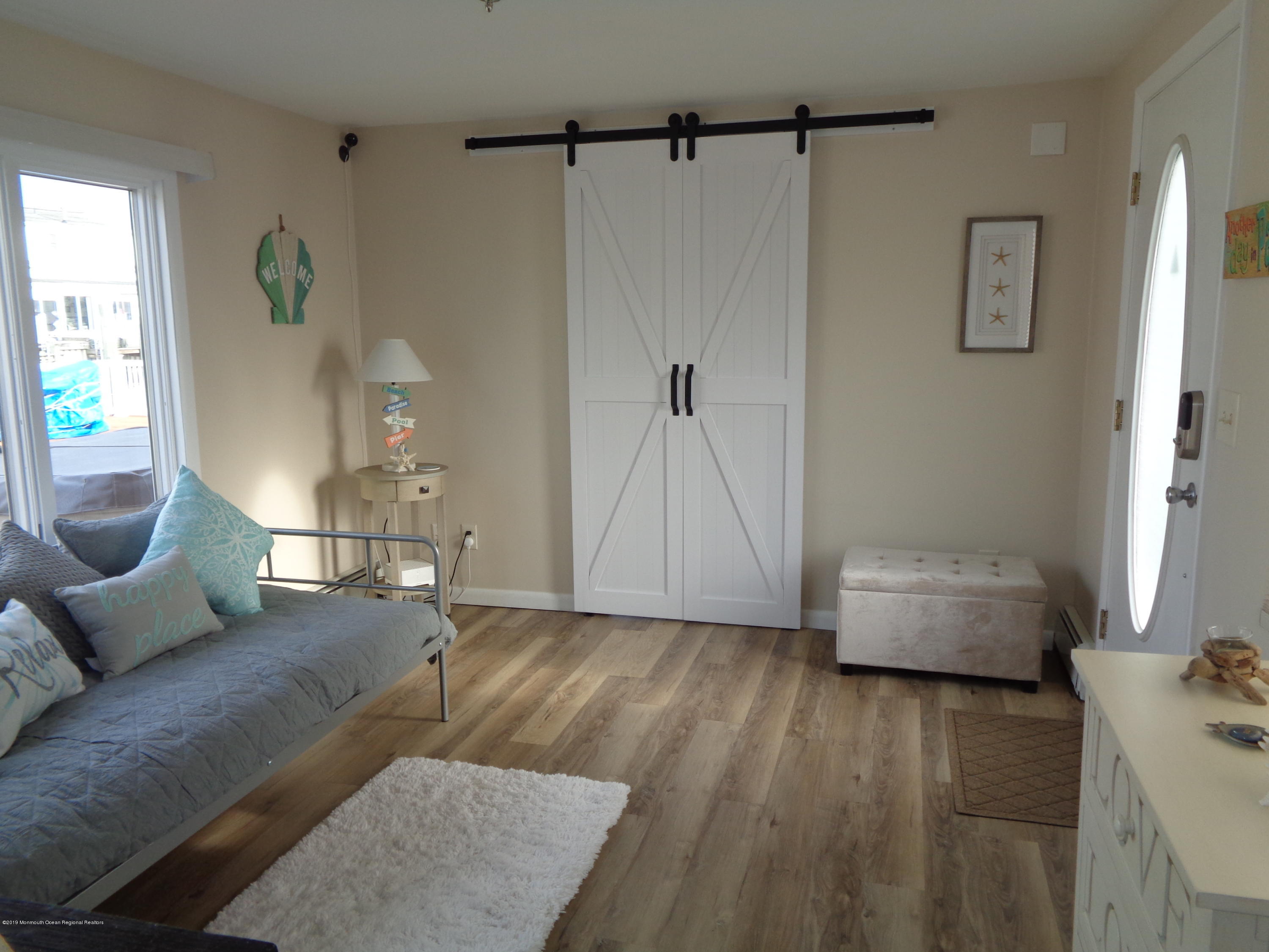 20 Capstan Road Waretown, NJ 08758 - Photo 3 of 25 a living room with furniture and a wooden floor