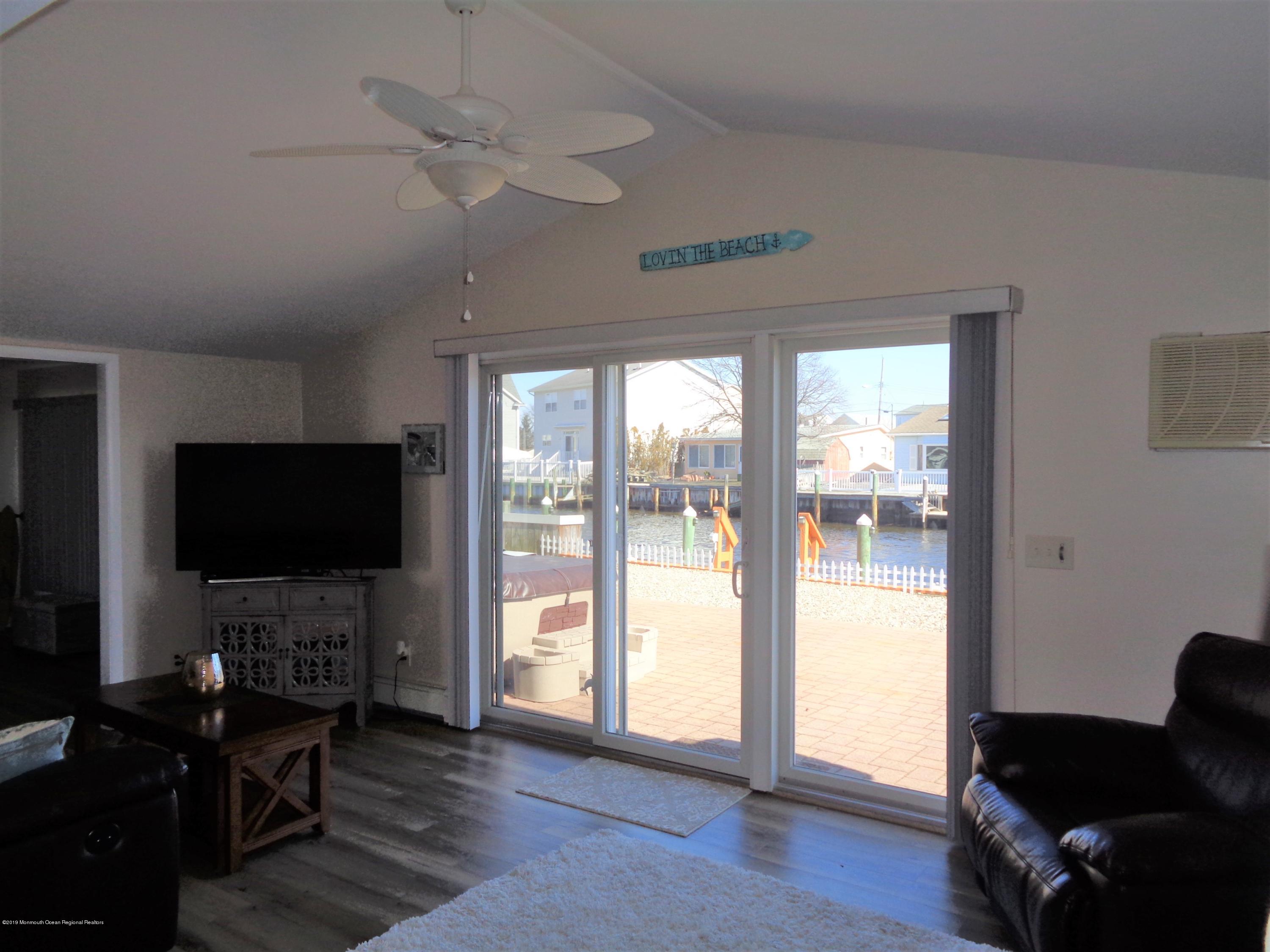20 Capstan Road Waretown, NJ 08758 - Photo 5 of 25 a living room with furniture and a flat screen tv