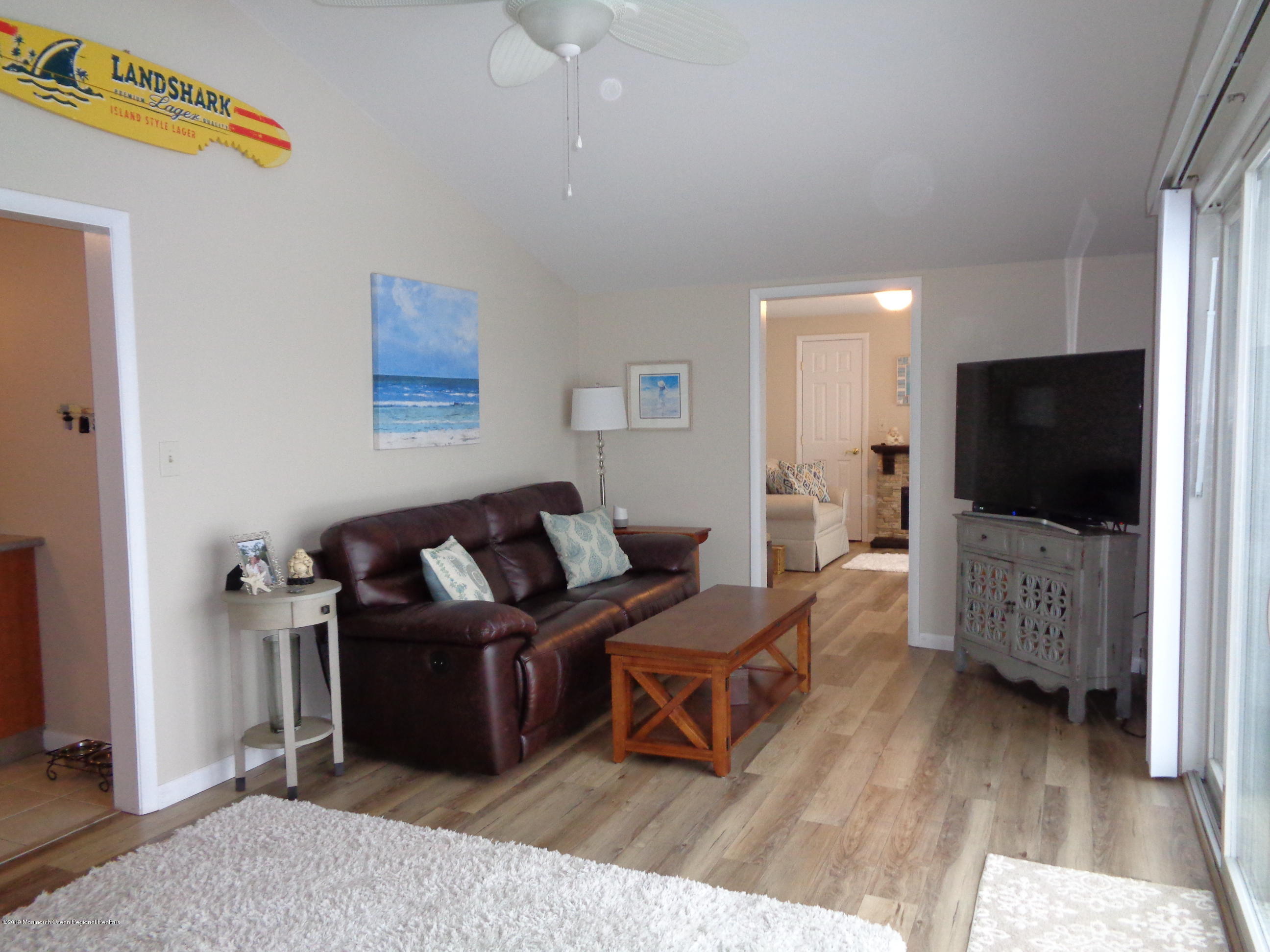 20 Capstan Road Waretown, NJ 08758 - Photo 7 of 25 a living room with furniture and a flat screen tv