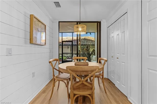 a dining room with furniture and window
