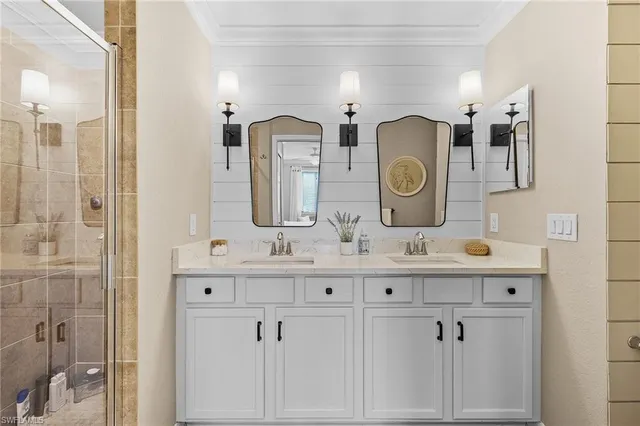 a bathroom with a double vanity sink and a mirror
