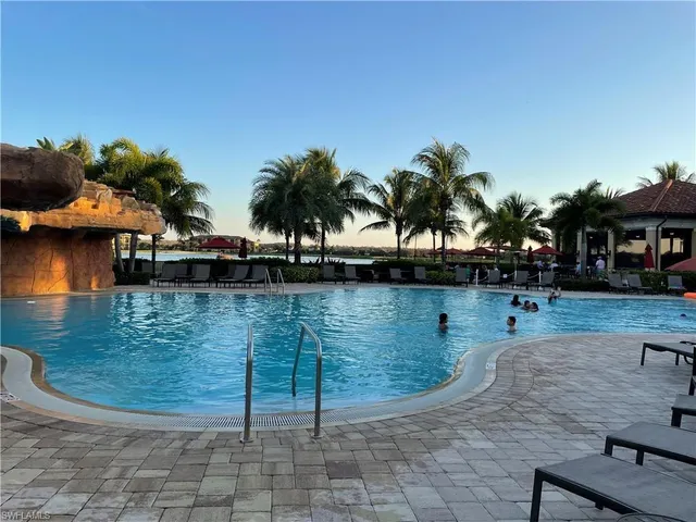 a view of a swimming pool with a patio
