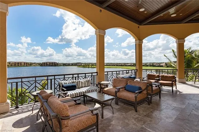 a roof deck with couches and city view