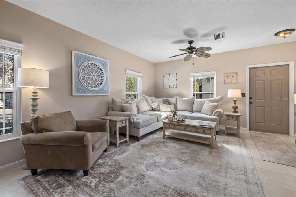 14932 Amberjack Terrace Lakewood Ranch, FL 34202 - Photo 8 of 45 a living room with furniture and a ceiling fan
