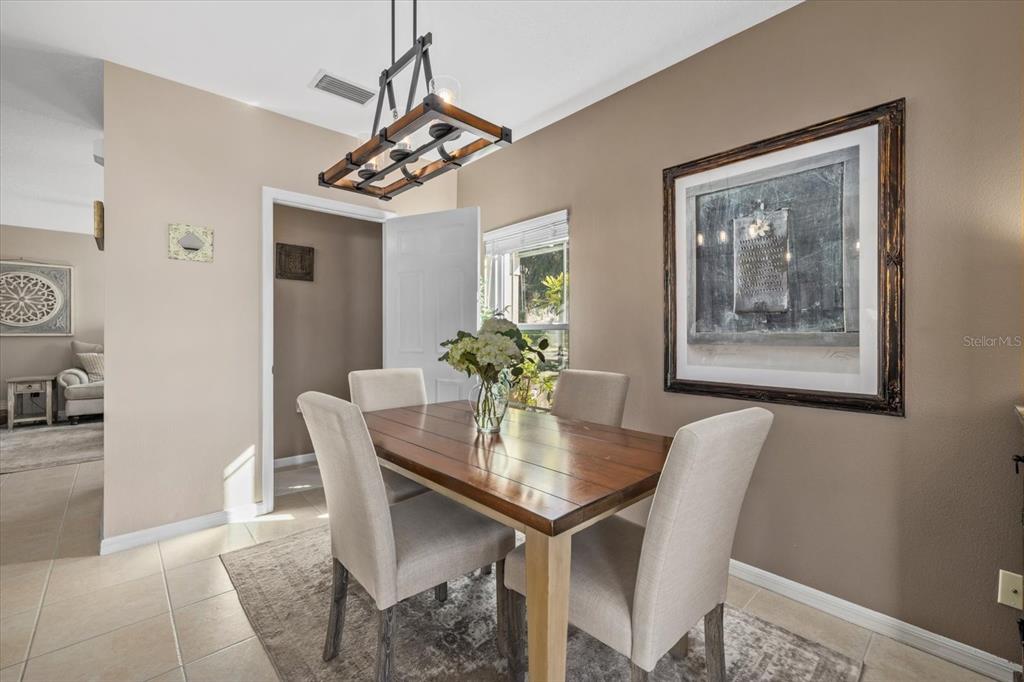 14932 Amberjack Terrace Lakewood Ranch, FL 34202 - Photo 10 of 45 a view of a dining room with furniture
