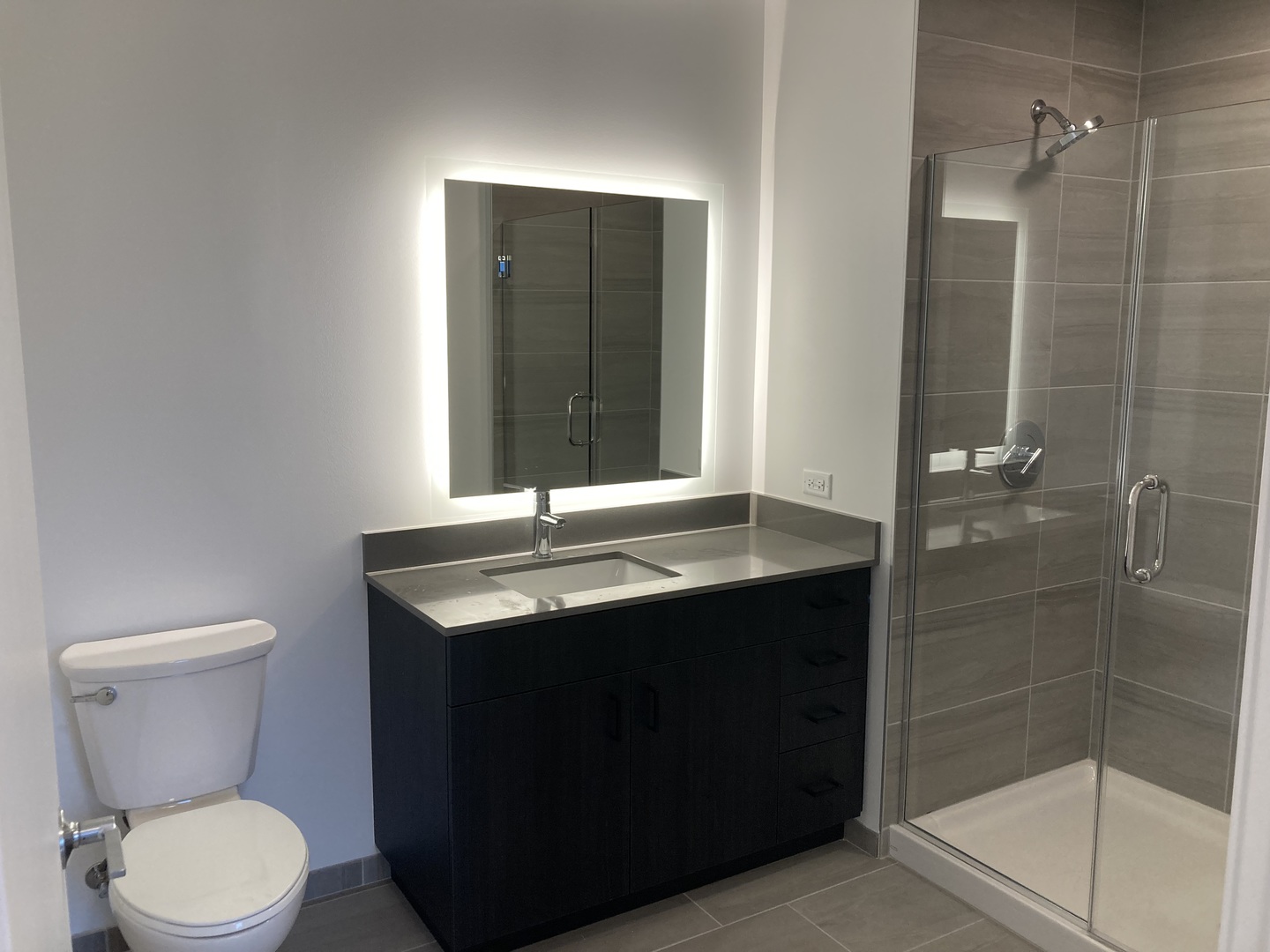 808 North Cleveland Avenue, Unit 1606 Chicago, IL 60610 - Photo 11 of 11 a bathroom with a sink toilet and shower