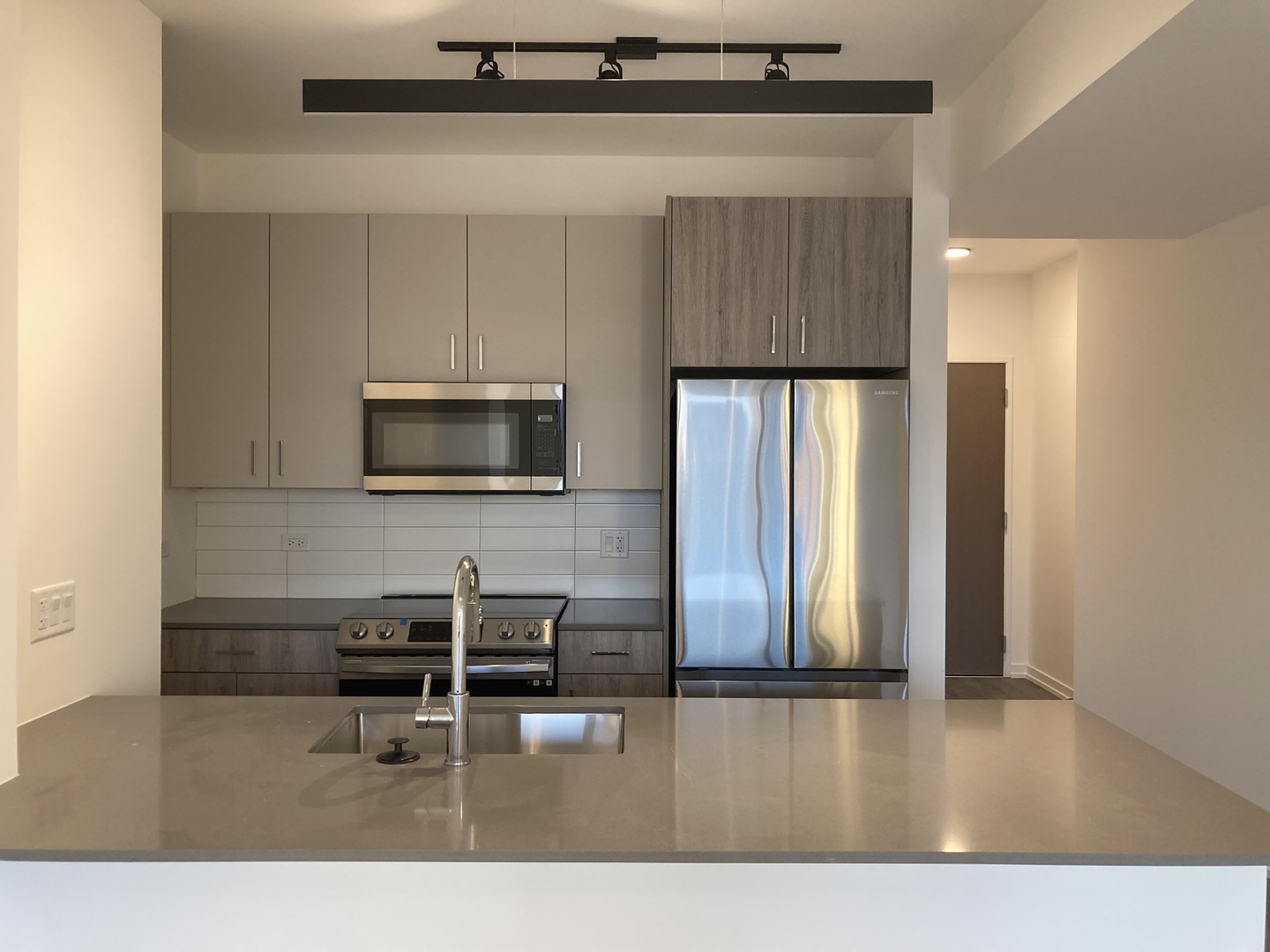 808 North Cleveland Avenue, Unit 1606 Chicago, IL 60610 - Photo 9 of 11 a kitchen with stainless steel appliances a refrigerator and microwave