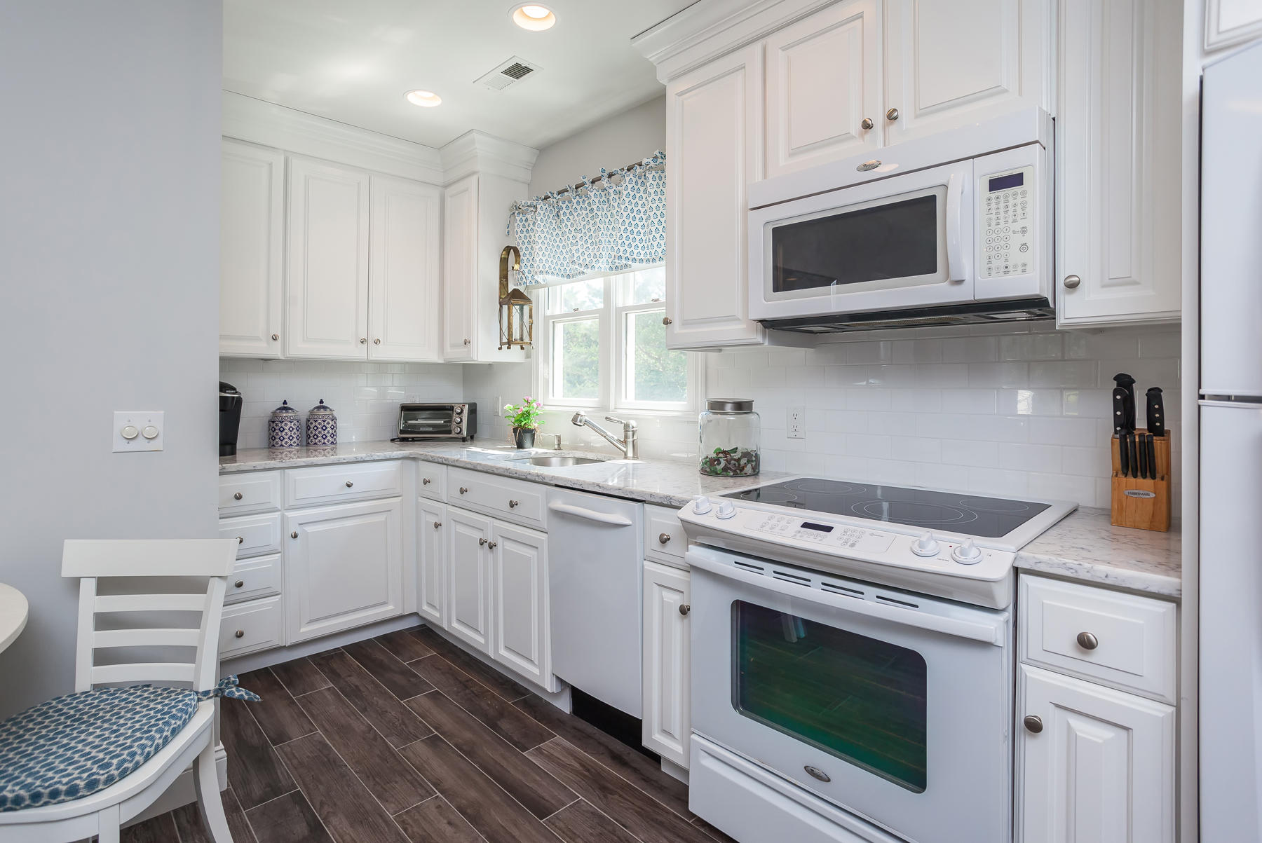 31 Torrey Road East Sandwich, MA 02537 - Photo 26 of 35 a kitchen with white cabinets stainless steel appliances and sink