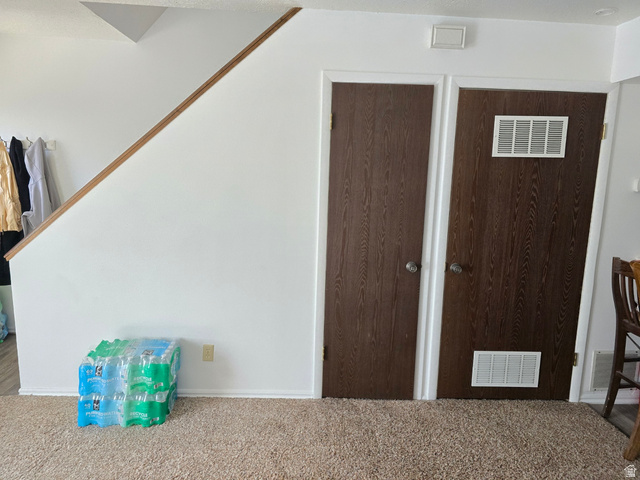 1273 North 400 East, Unit 4 Logan, UT 84341 - Photo 6 of 12 Carpeted flooring extending to wood-look doors with round door handles