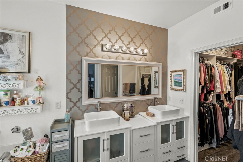 545 Lorabel Way, Unit D Simi Valley, CA 93065 - Photo 21 of 34 a bathroom with a sink and a mirror