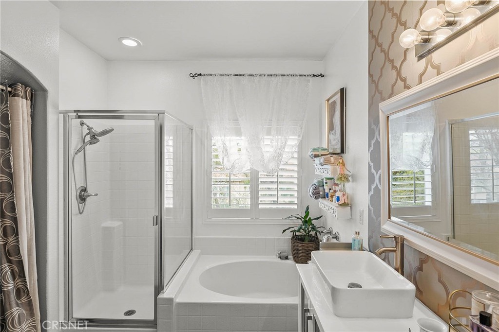 545 Lorabel Way, Unit D Simi Valley, CA 93065 - Photo 23 of 34 a bathroom with a tub shower and sink