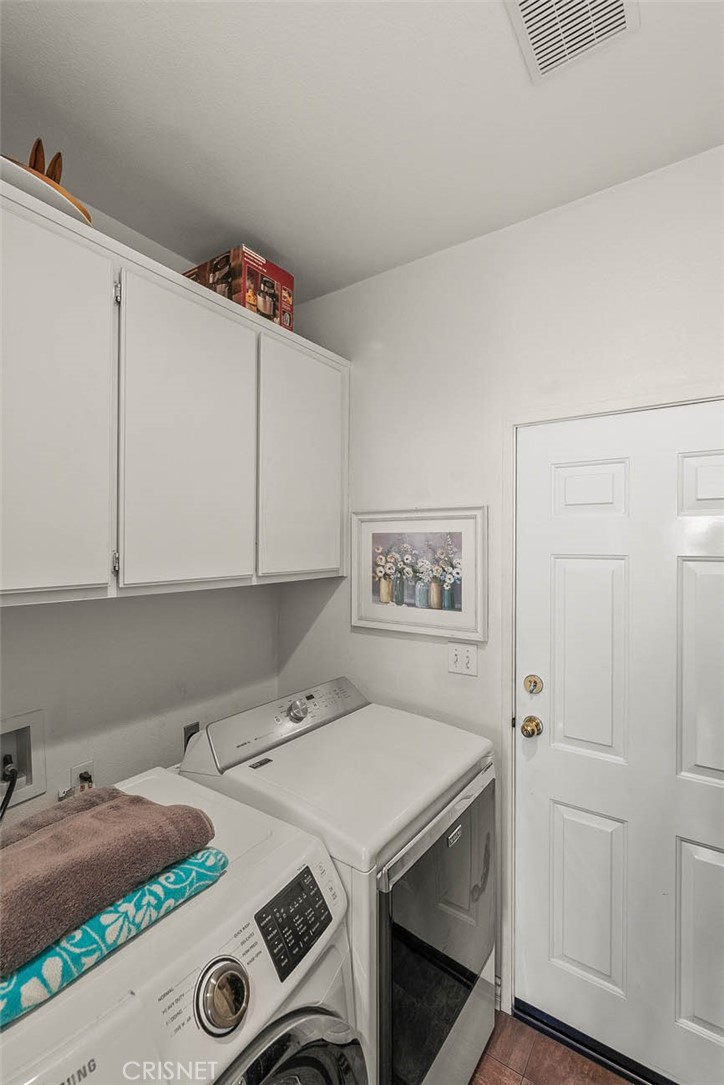 545 Lorabel Way, Unit D Simi Valley, CA 93065 - Photo 30 of 34 a utility room with dryer and washer
