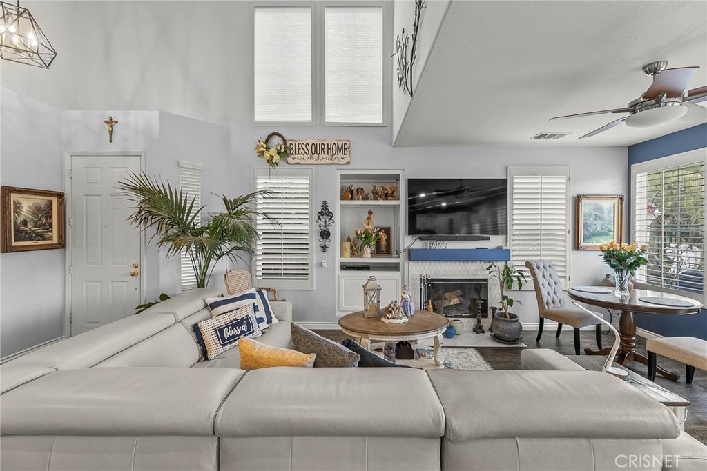 545 Lorabel Way, Unit D Simi Valley, CA 93065 - Photo 3 of 34 a living room with furniture and a fireplace