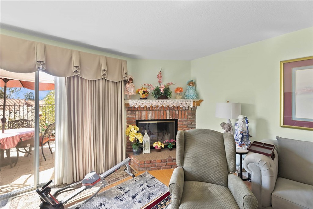 545 Lorabel Way, Unit D Simi Valley, CA 93065 - Photo 7 of 34 a living room with furniture and a fireplace