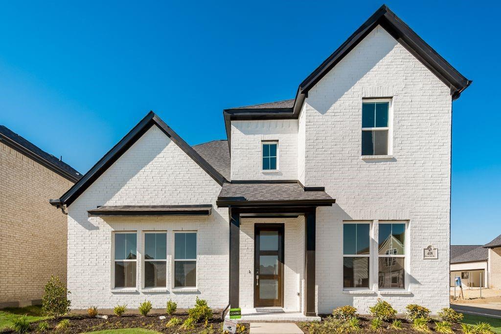 a front view of a house with glass windows