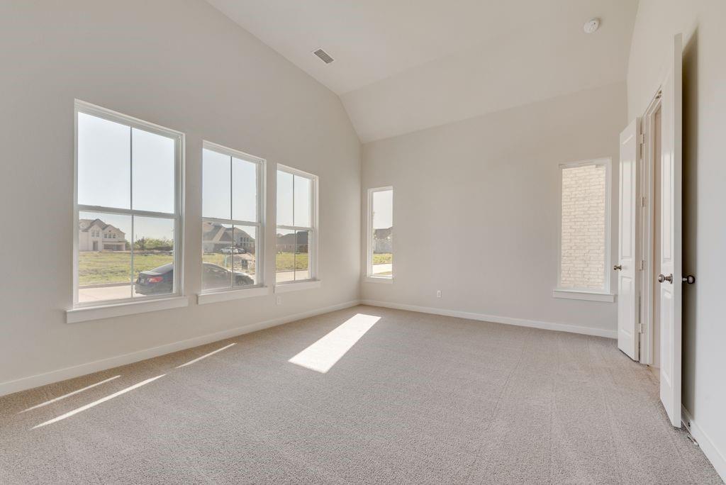 418 Bassett Hall Road Fate, TX 75189 - Photo 13 of 32 an empty room with windows