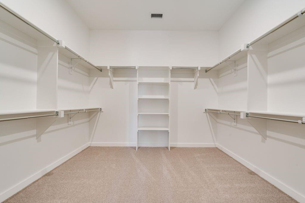 418 Bassett Hall Road Fate, TX 75189 - Photo 17 of 32 a view of an empty walk in closet