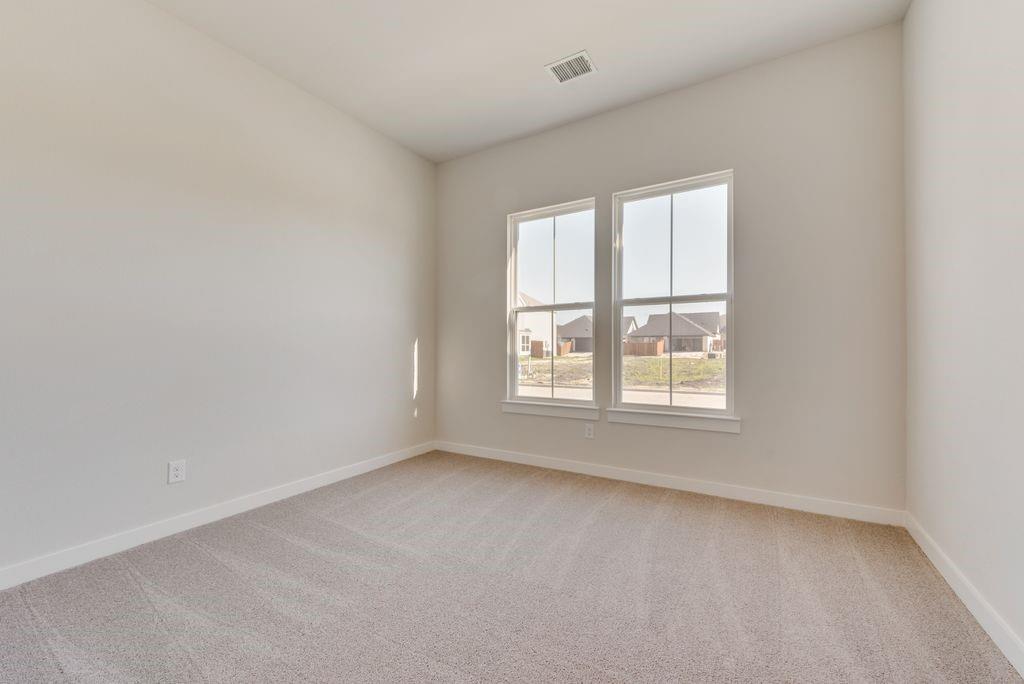 418 Bassett Hall Road Fate, TX 75189 - Photo 19 of 32 an empty room with a window