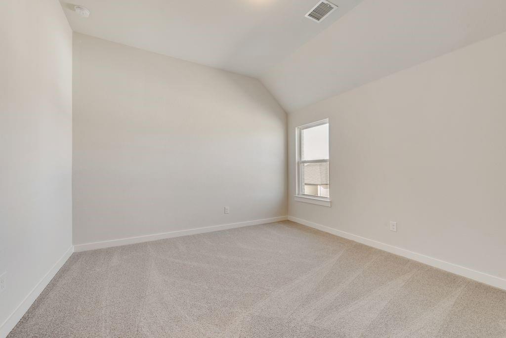 418 Bassett Hall Road Fate, TX 75189 - Photo 23 of 32 a view of an empty room with a window