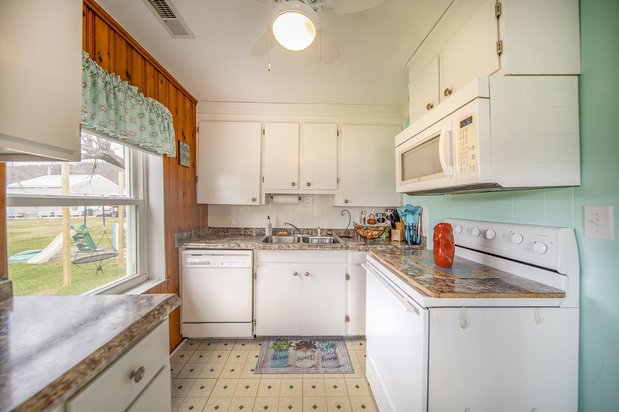 415 Turner Road Salem, VA 24153 - Photo 11 of 27 a kitchen with a sink stove and cabinets