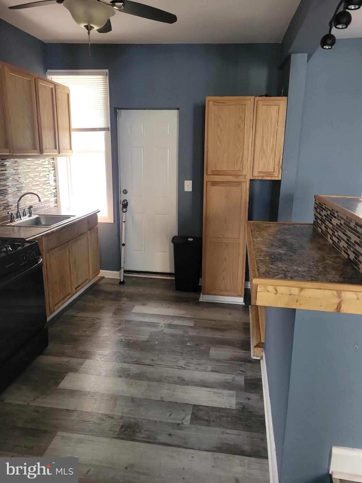 2109 Rupp Street Baltimore, MD 21217 - Photo 1 of 24 a kitchen with granite countertop a refrigerator and a sink