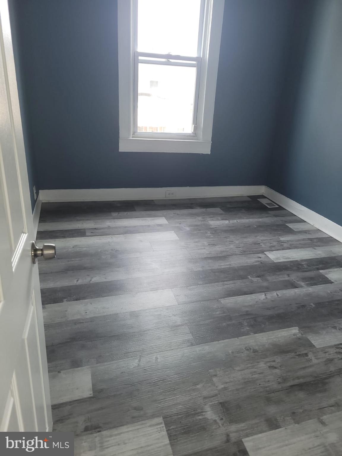 2109 Rupp Street Baltimore, MD 21217 - Photo 12 of 24 a view of a room with rack and a window