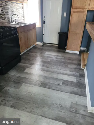 a view of a kitchen from the hallway