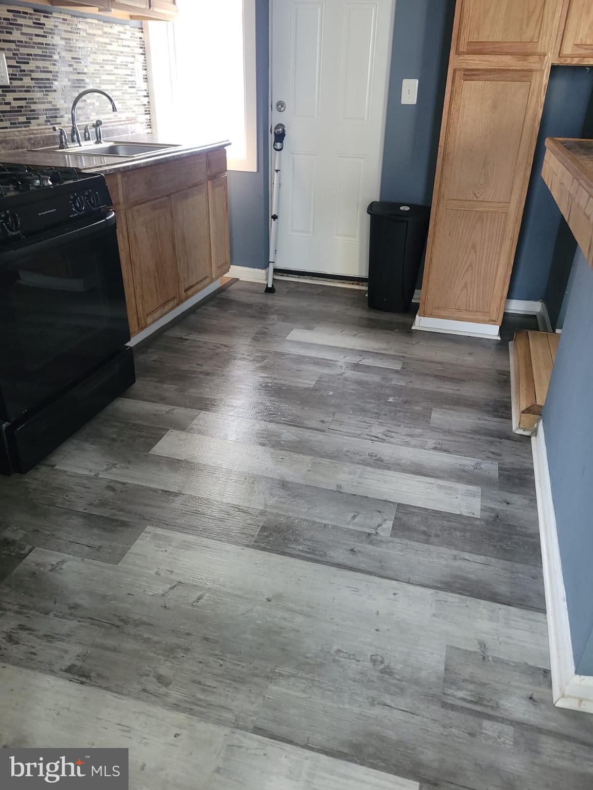 2109 Rupp Street Baltimore, MD 21217 - Photo 6 of 24 a view of a kitchen from the hallway