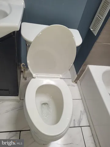 a close view of a toilet in a bathroom