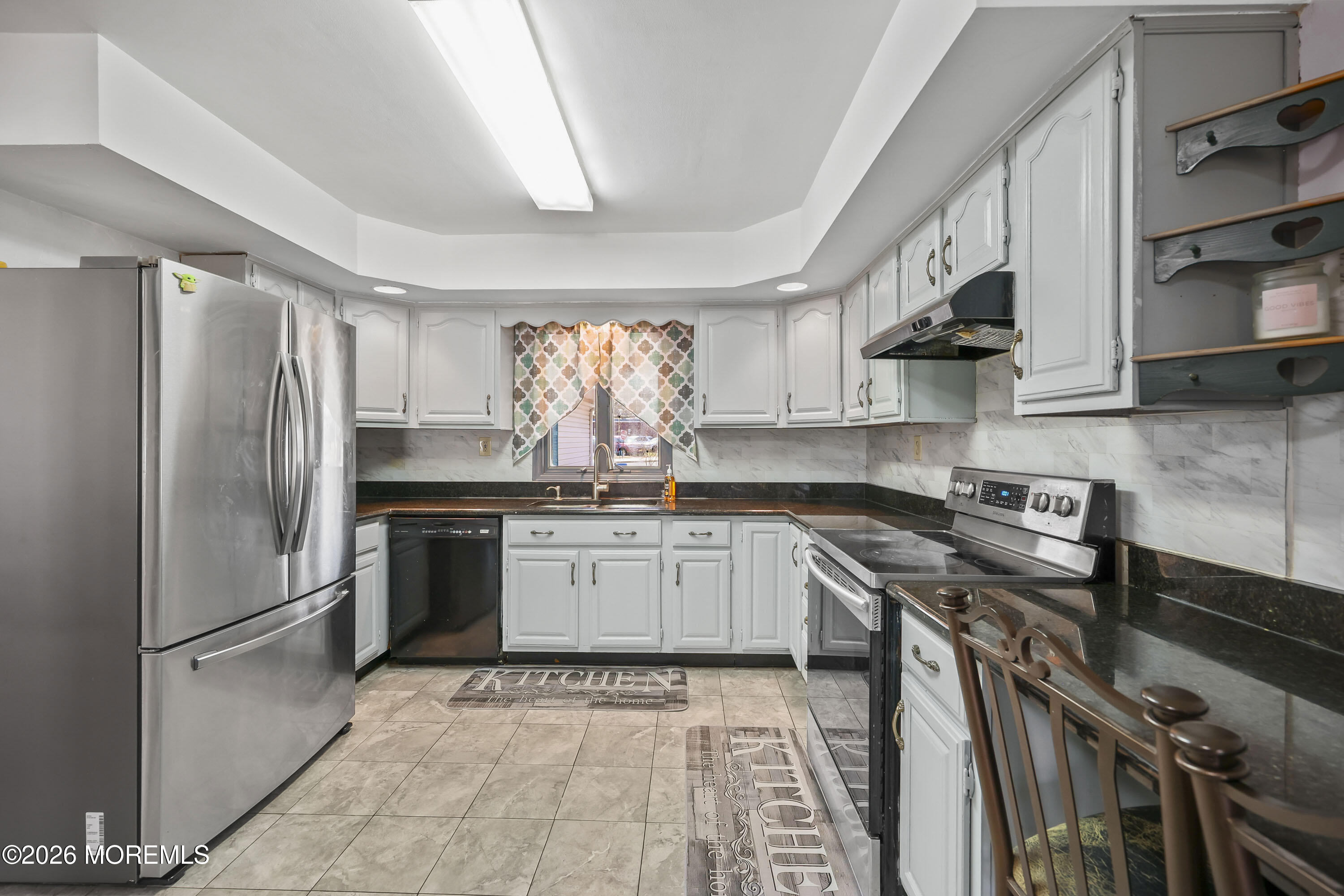 287 Church Street Aberdeen, NJ 07747 - Photo 2 of 15 a kitchen with stainless steel appliances granite countertop a stove a refrigerator and a sink