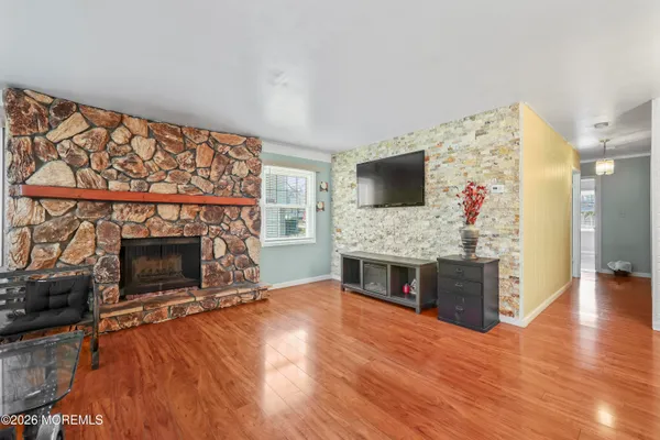 a living room with fireplace furniture and a flat screen tv