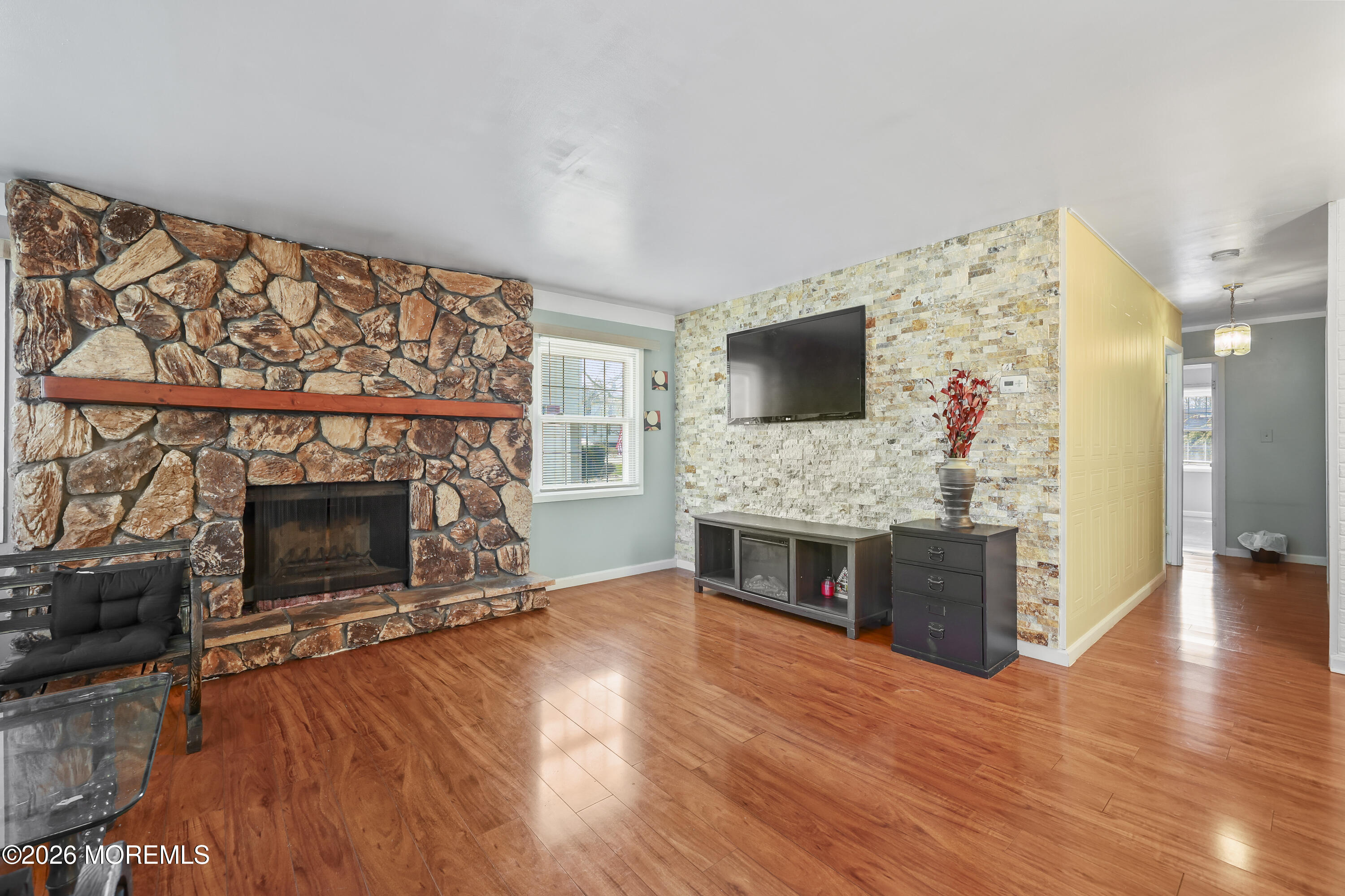 287 Church Street Aberdeen, NJ 07747 - Photo 6 of 15 a living room with fireplace furniture and a flat screen tv