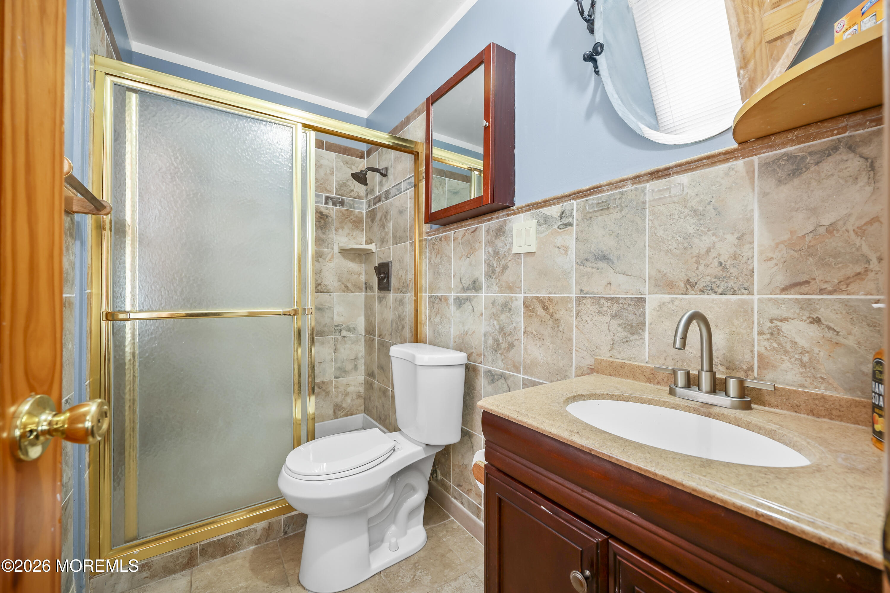 287 Church Street Aberdeen, NJ 07747 - Photo 10 of 15 a bathroom with a sink a toilet and shower