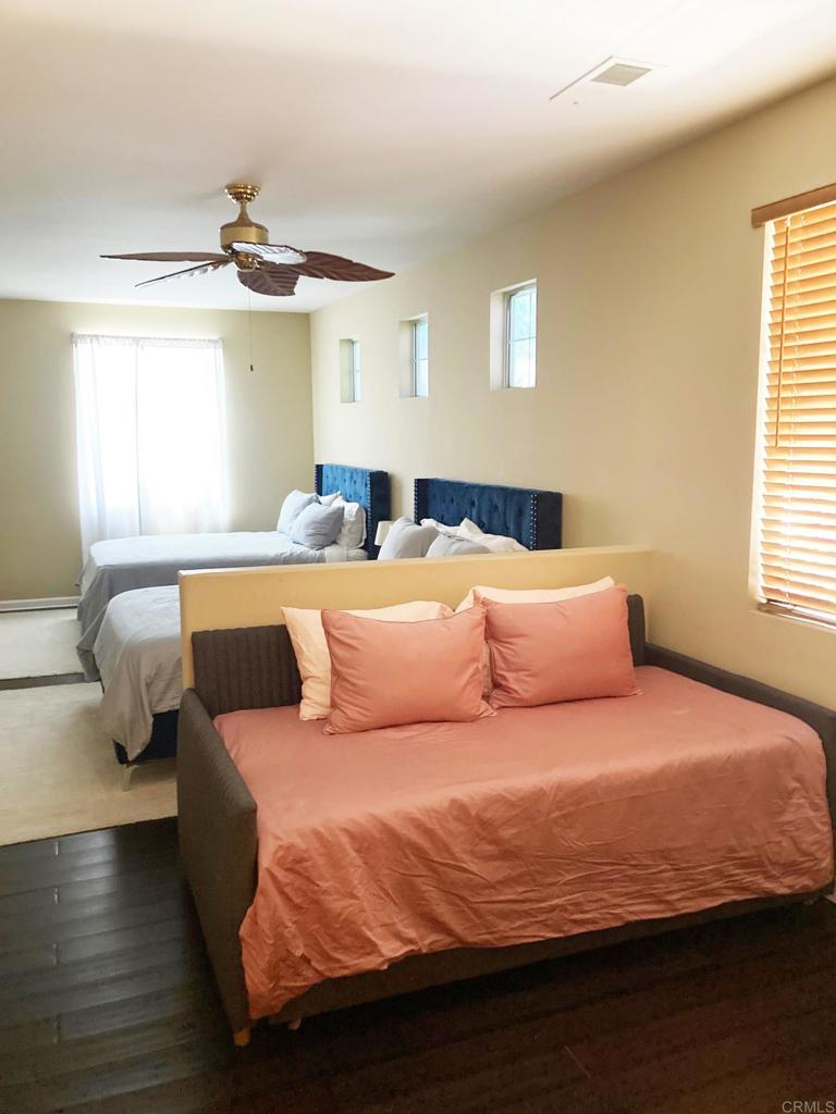 80596 Key Largo Avenue Indio, CA 92201 - Photo 21 of 59 a bedroom with a bed and window